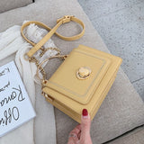 Stone Buckle Leather Mini Crossbody Bag