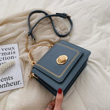 Stone Buckle Leather Mini Crossbody Bag